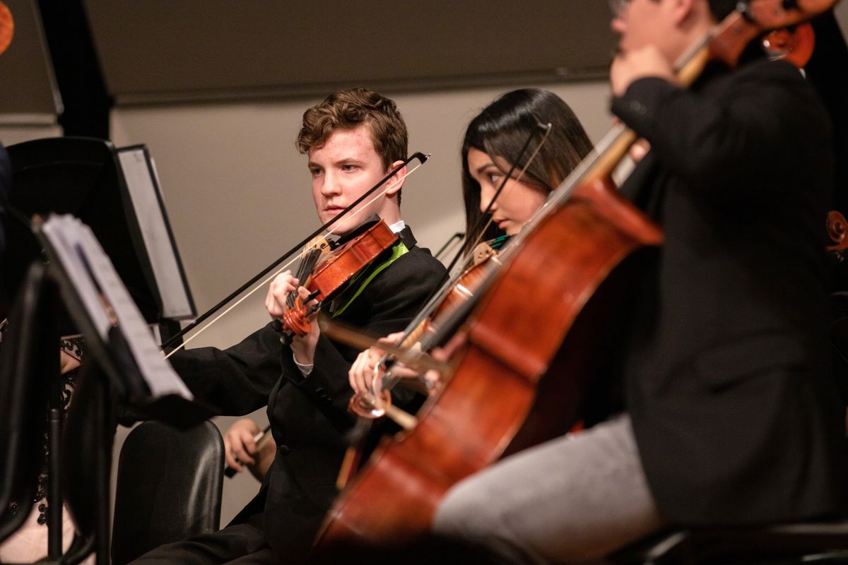 Young musicians performing together on stage